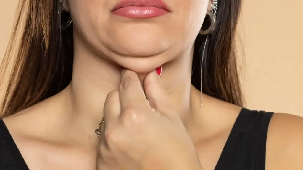 An image of a woman with double chin, sad, worried : Non Surgical Double Chin Removal Treatment in Stevenage Ware, UK